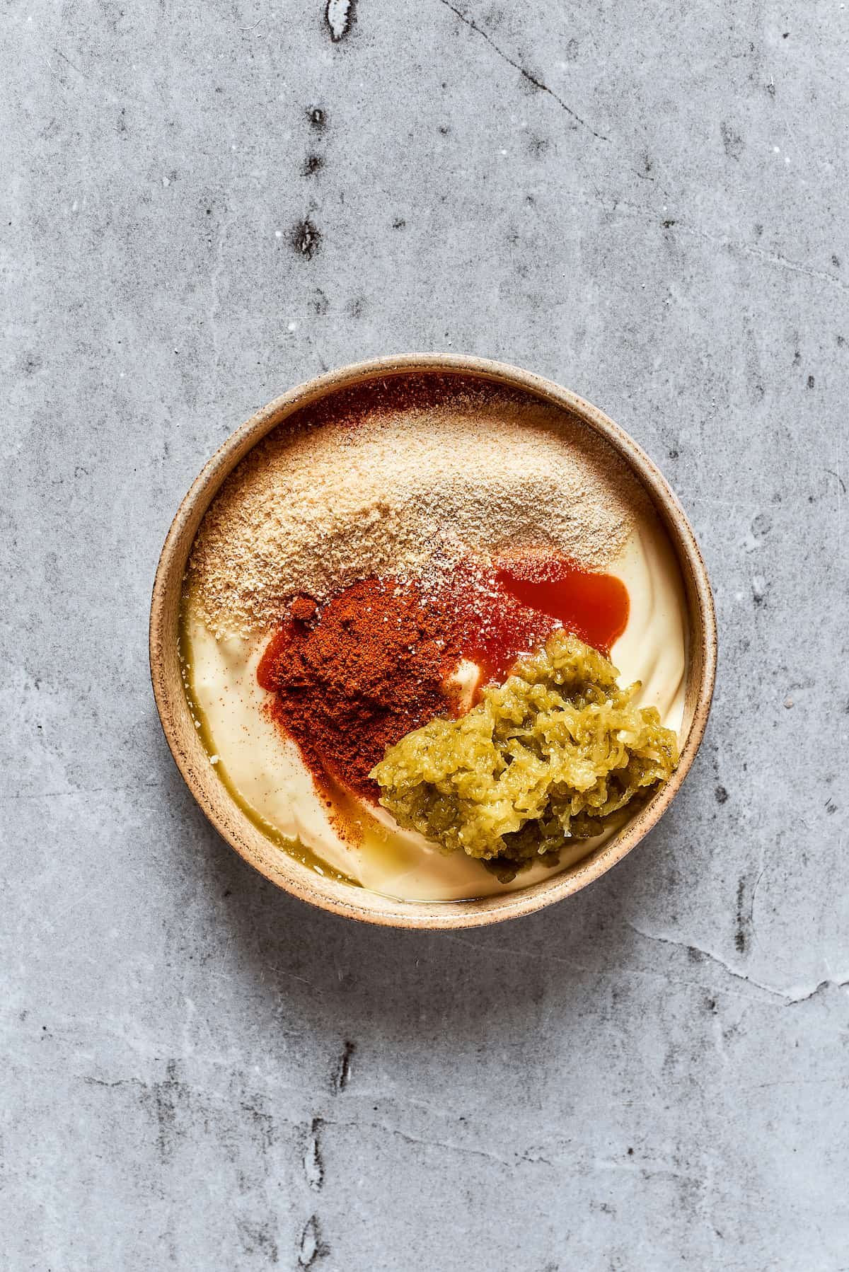 Spicy mayonnaise ingredients in a bowl.