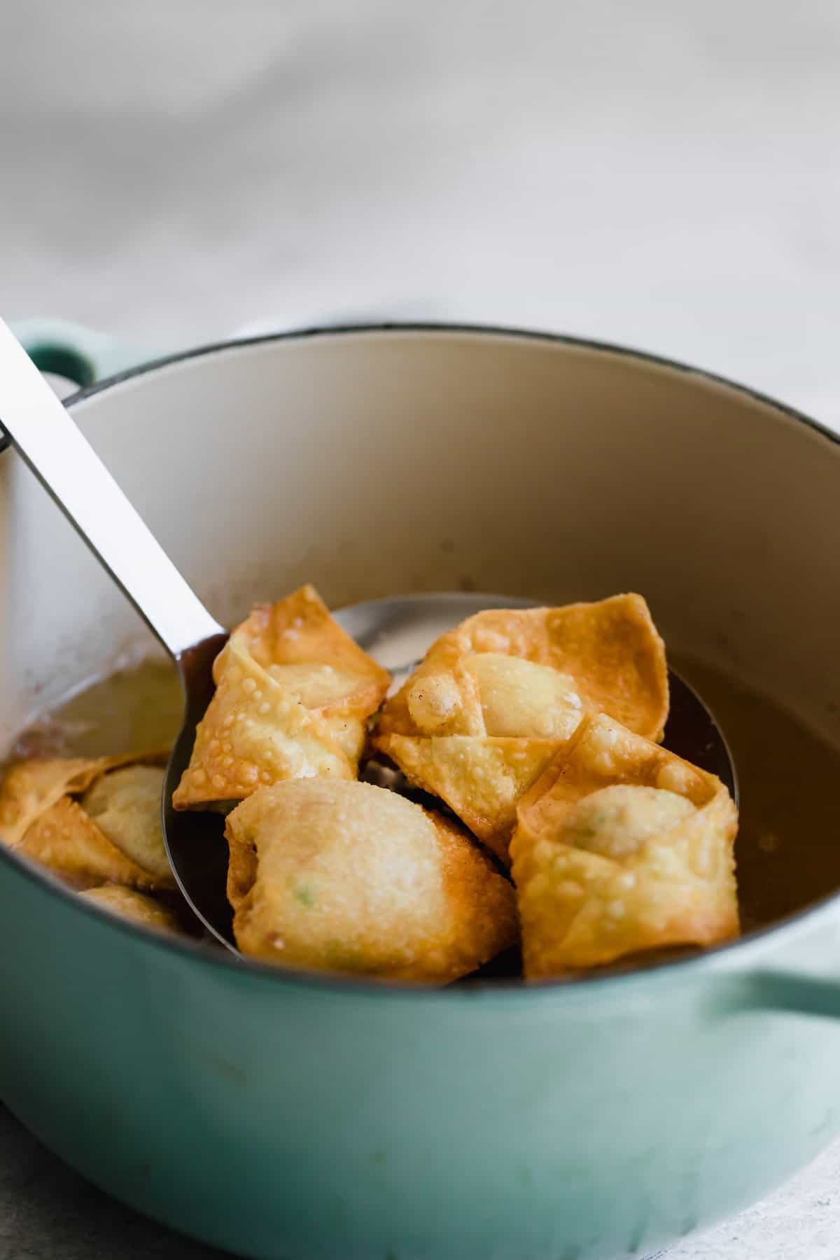 draining fried crab rangoon