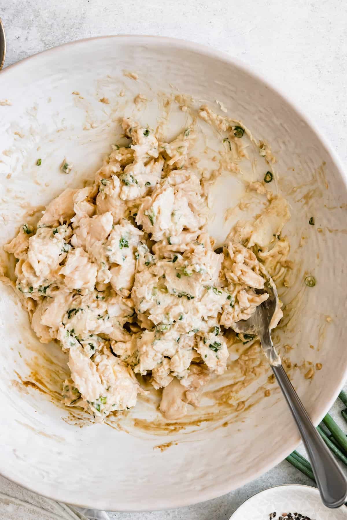 A bowl with crab rangoon filling ready to be used.