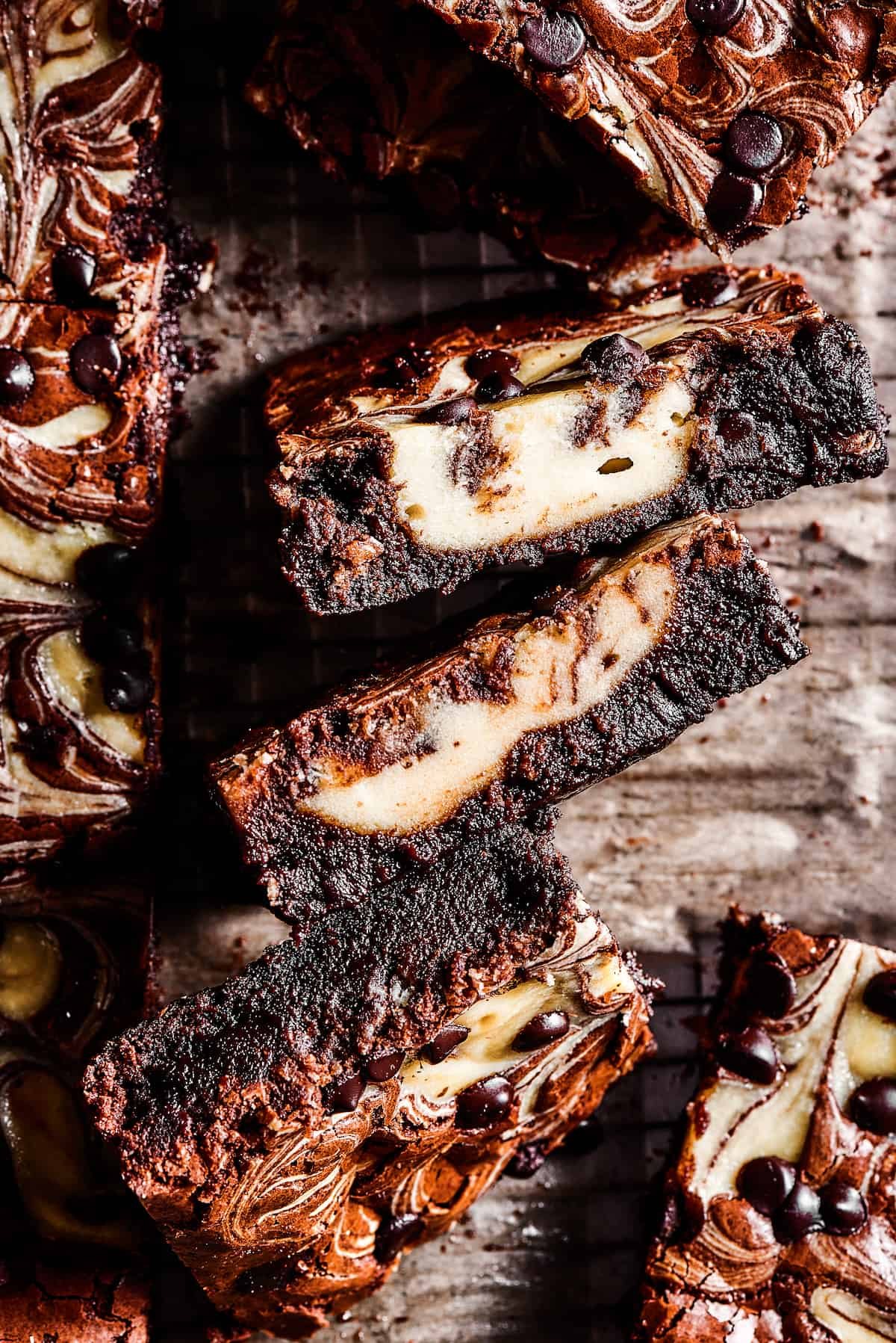 Side view of brownies with cream cheese filling swirled through.