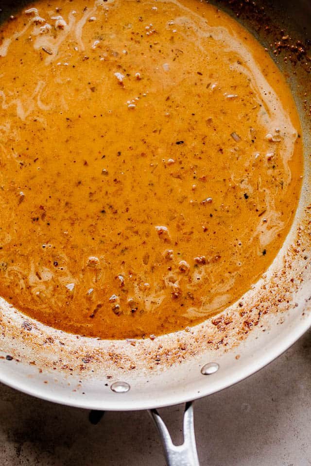 overhead shot of heavy cream sauce in a skillet