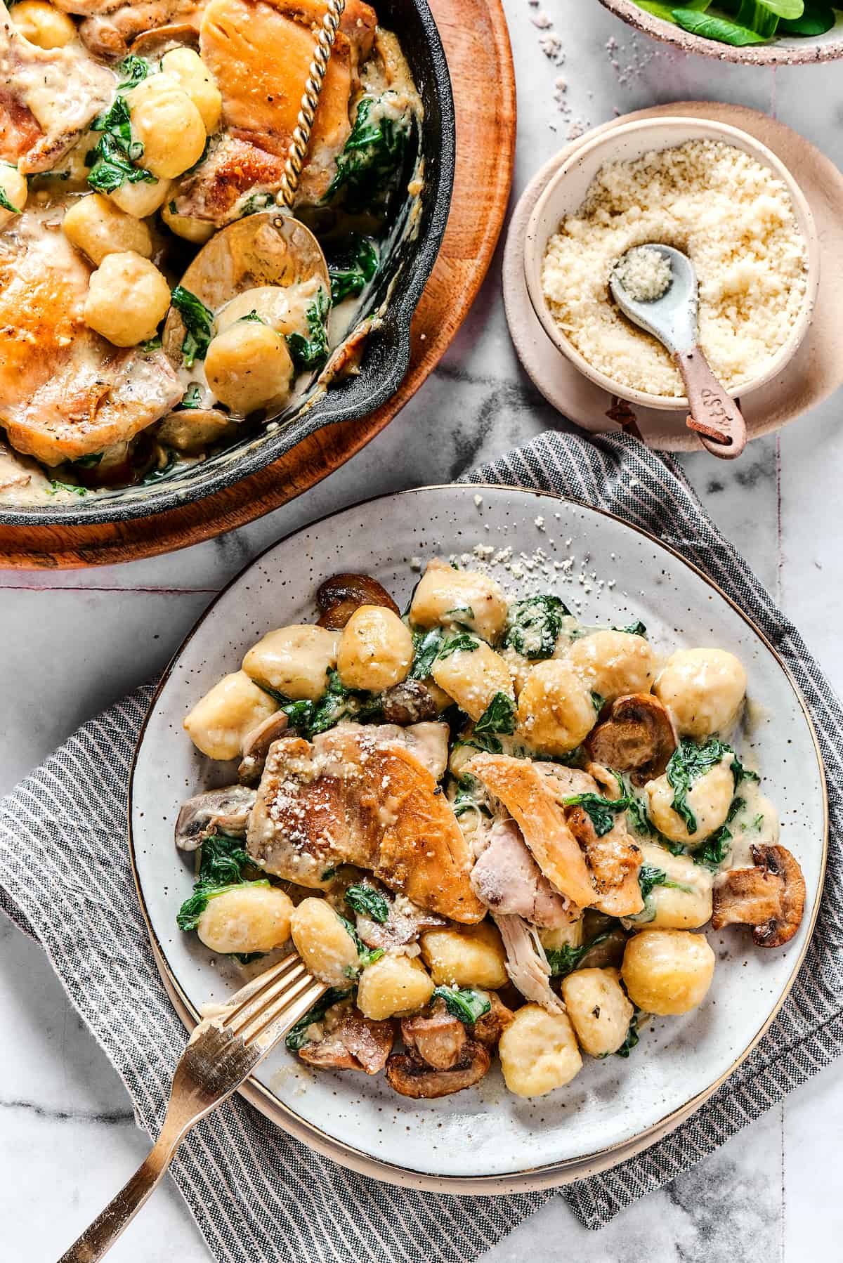 Overhead shot of a chicken skillet dish served onto a dinner plate.