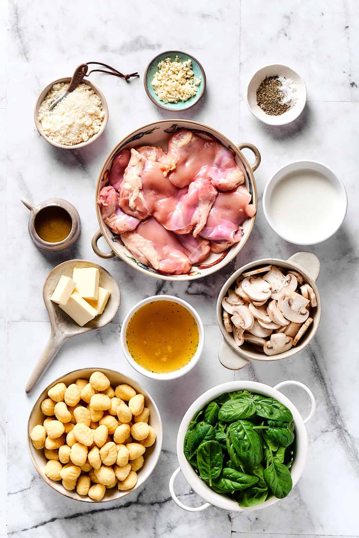 Chicken gnocchi ingredients measured and arranged on a table.