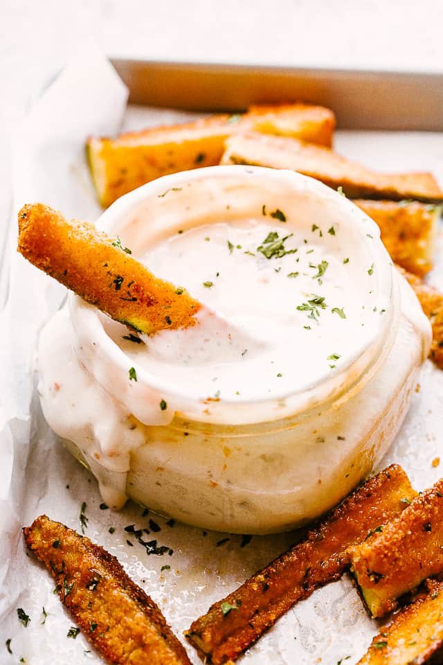 Zucchini fries dipped in a delicious sauce.