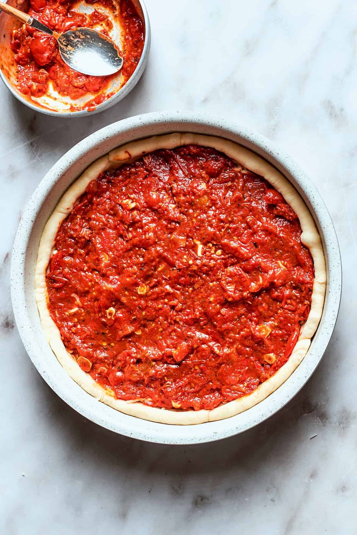 Sauce is added to the dough.