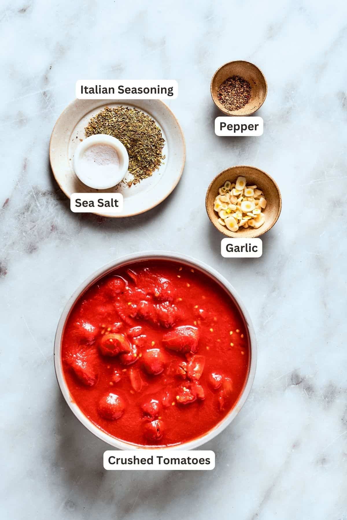 Deep dish pizza sauce ingredients: canned tomatoes, garlic, pepper, Italian seasoning, salt.