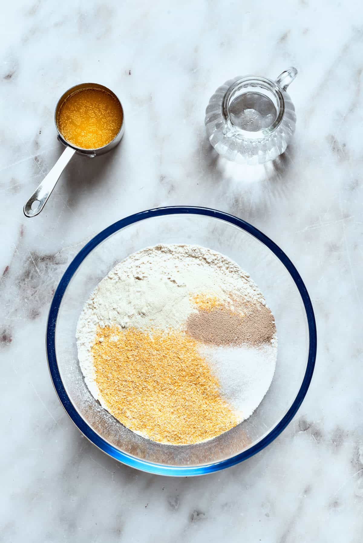 The dry ingredients for deep dish pizza crust in a bowl.