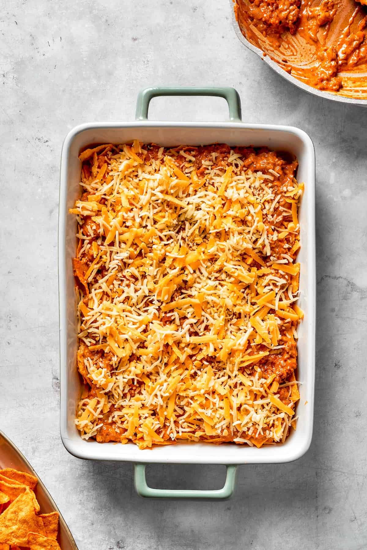 An assembled Dorito casserole in a casserole dish.