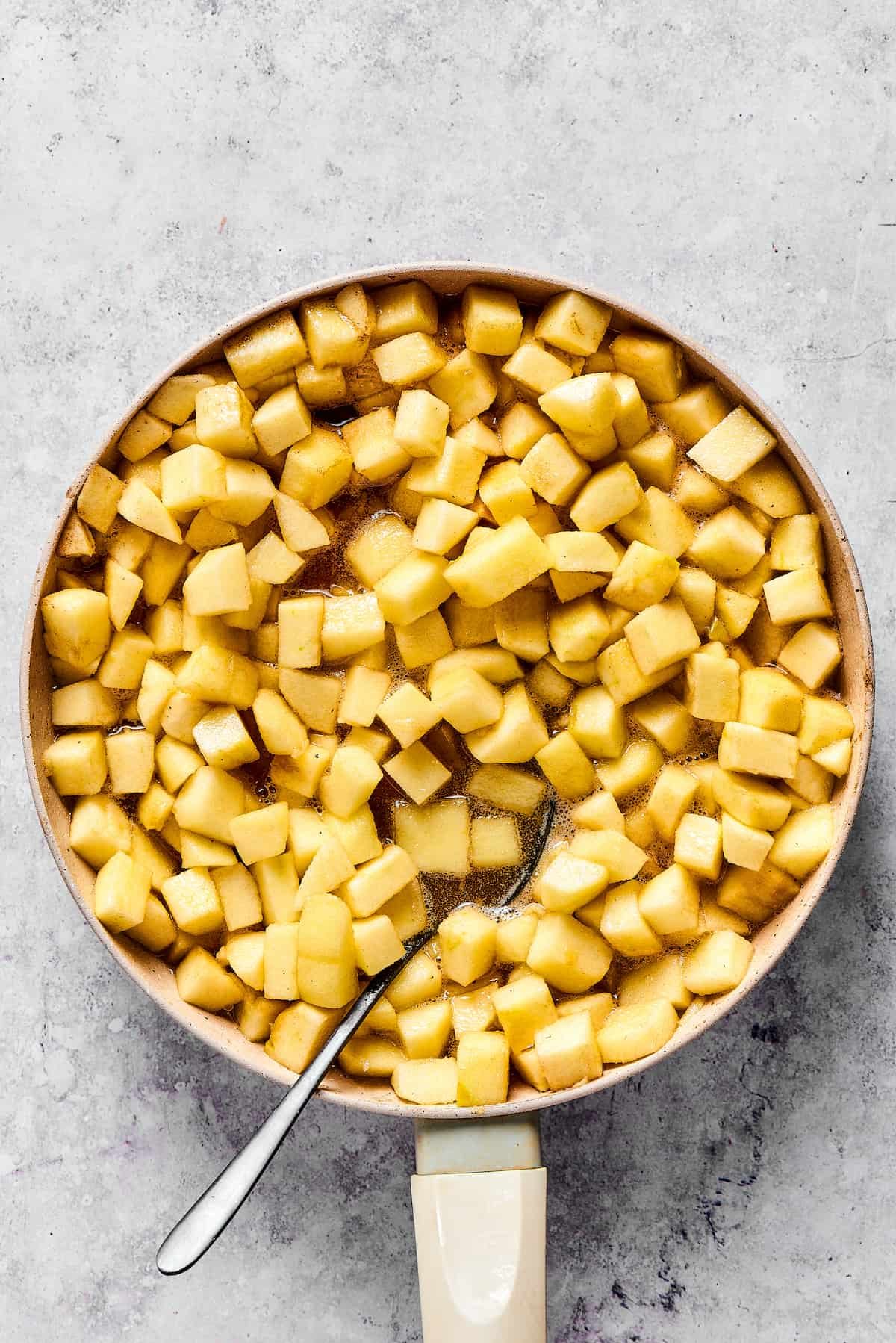 Cooking apples in a skillet.