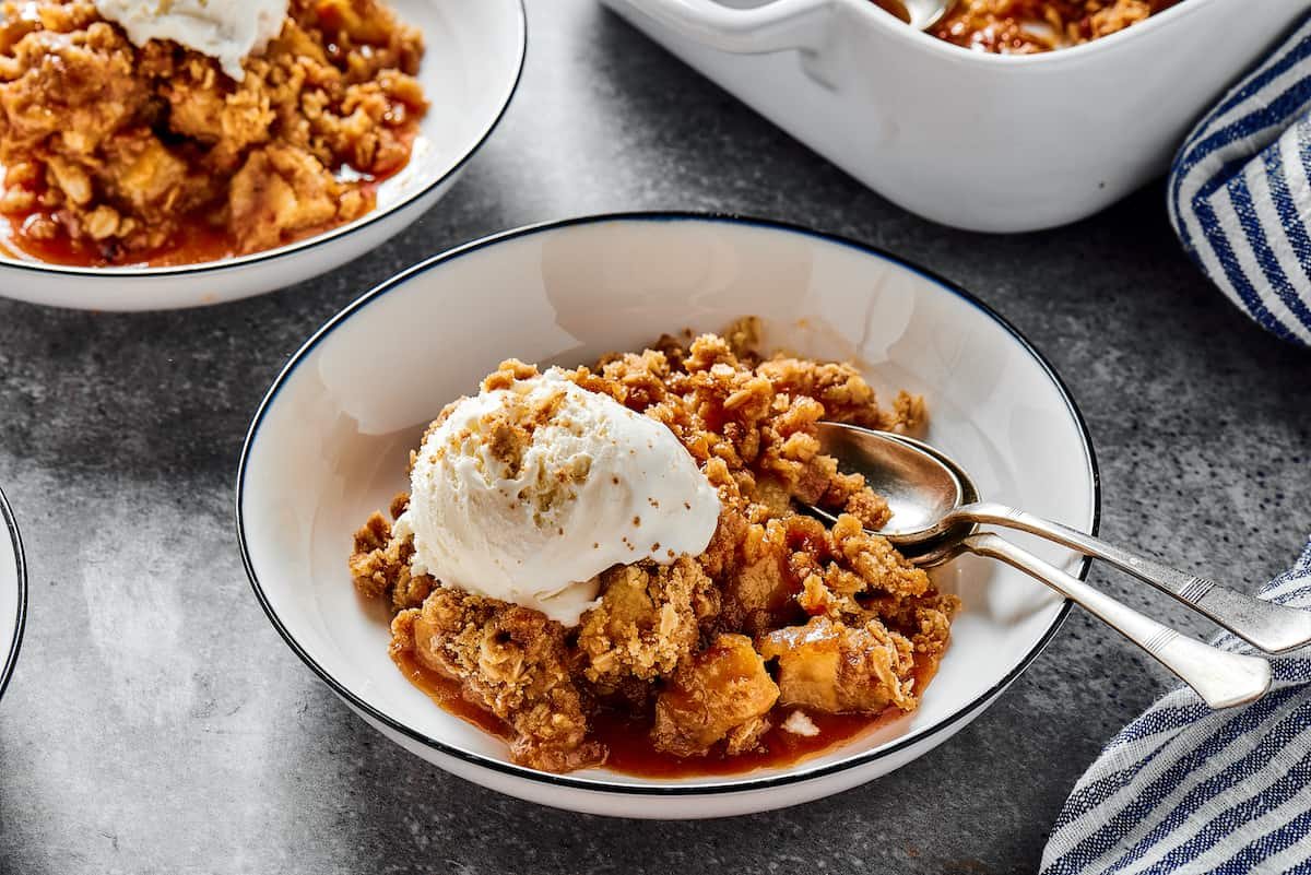 Apple crisp a la mode, in dessert plates.