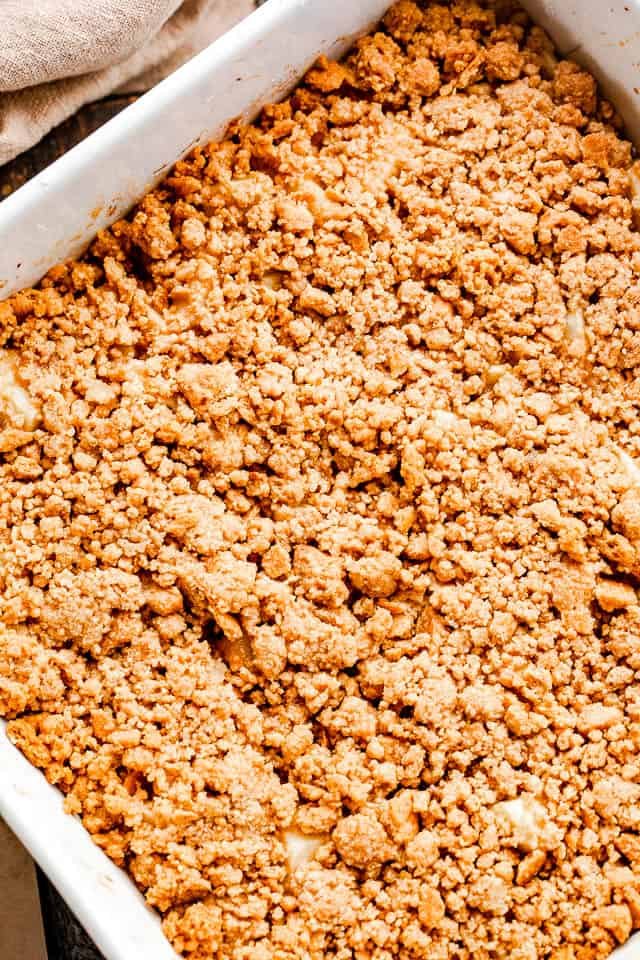 overhead shot of an apple crumble topped with graham cracker crust