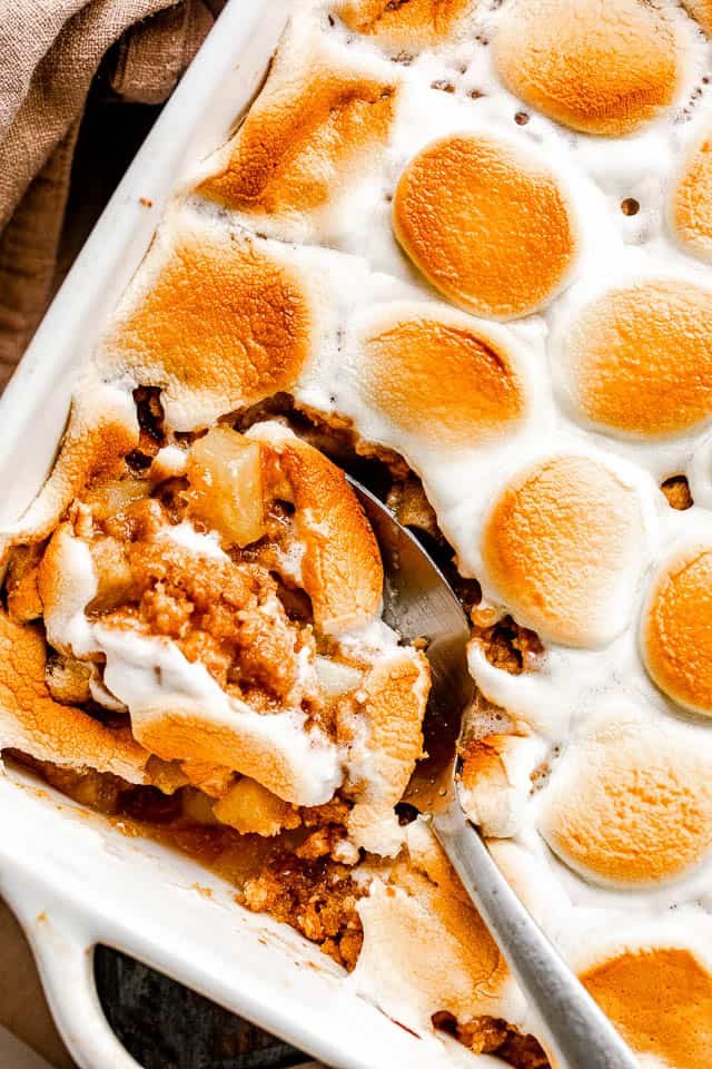 overhead shot of a spoon cutting into an apple crumble