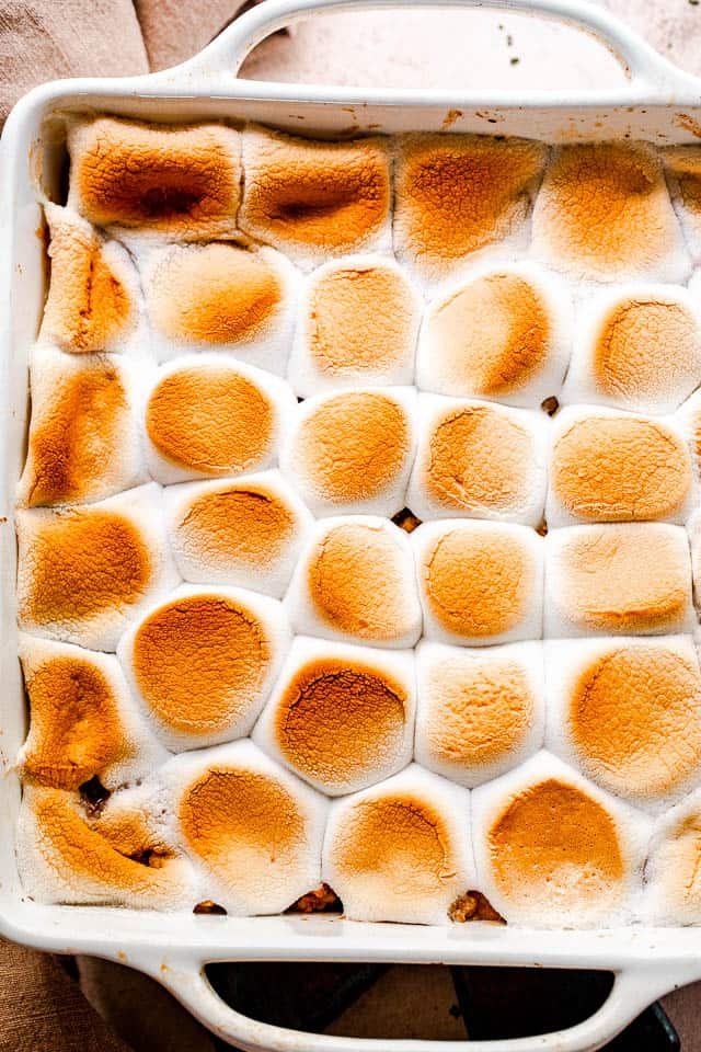 overhead shot of an apple crumble topped with toasted marshmallows