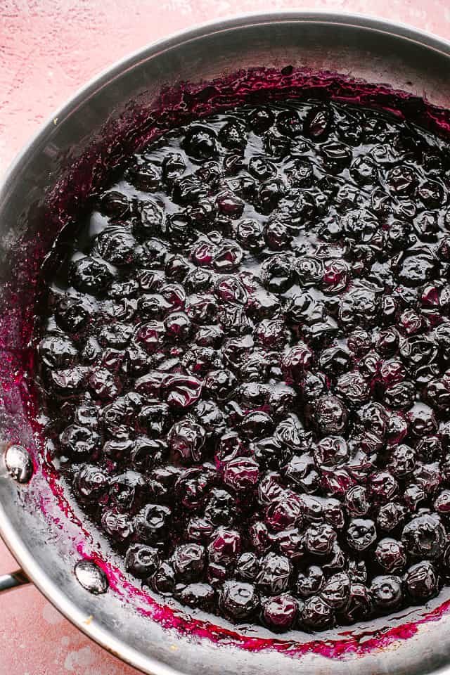 Cooking down the blueberries.