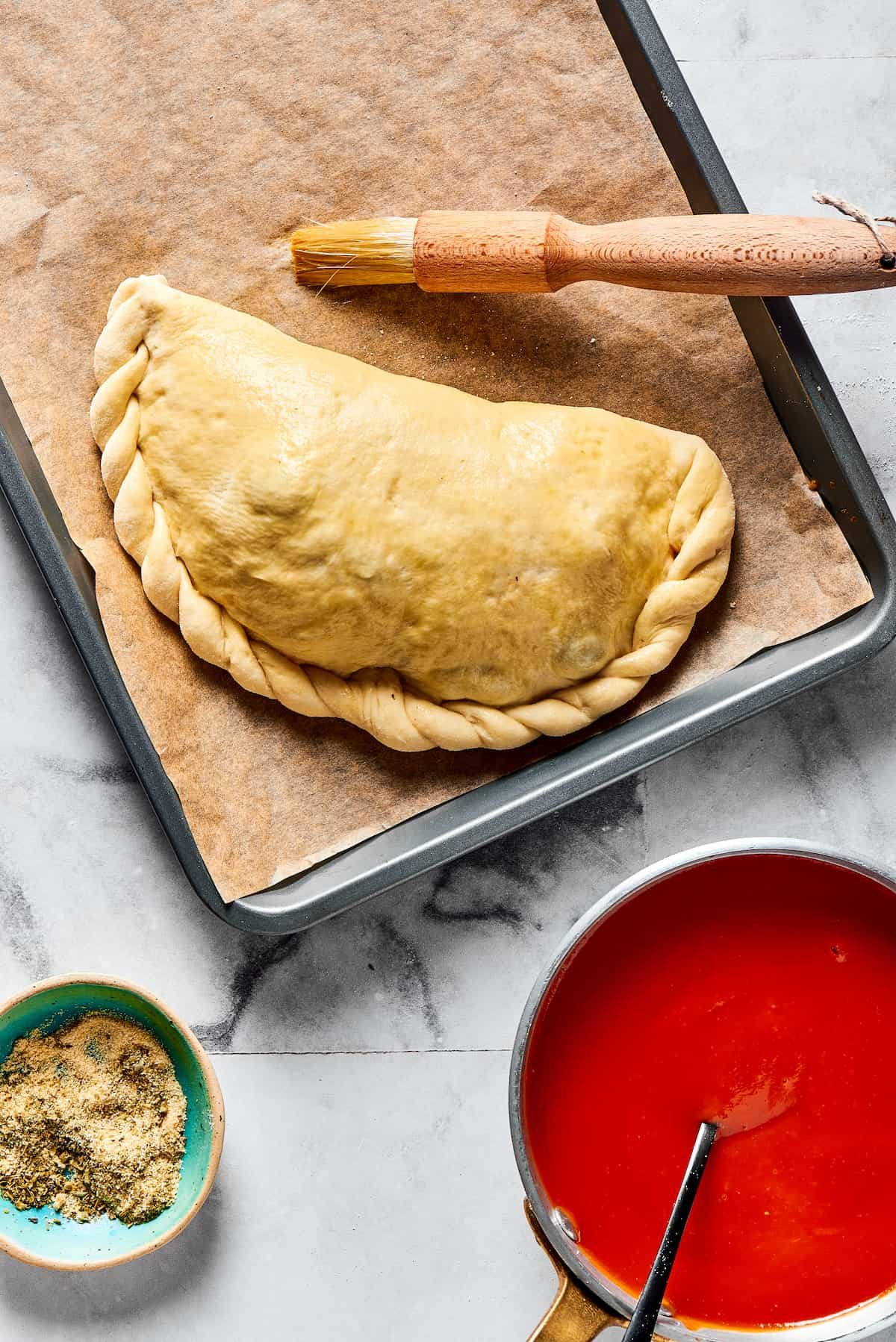 A folded calzone with crimped edges.