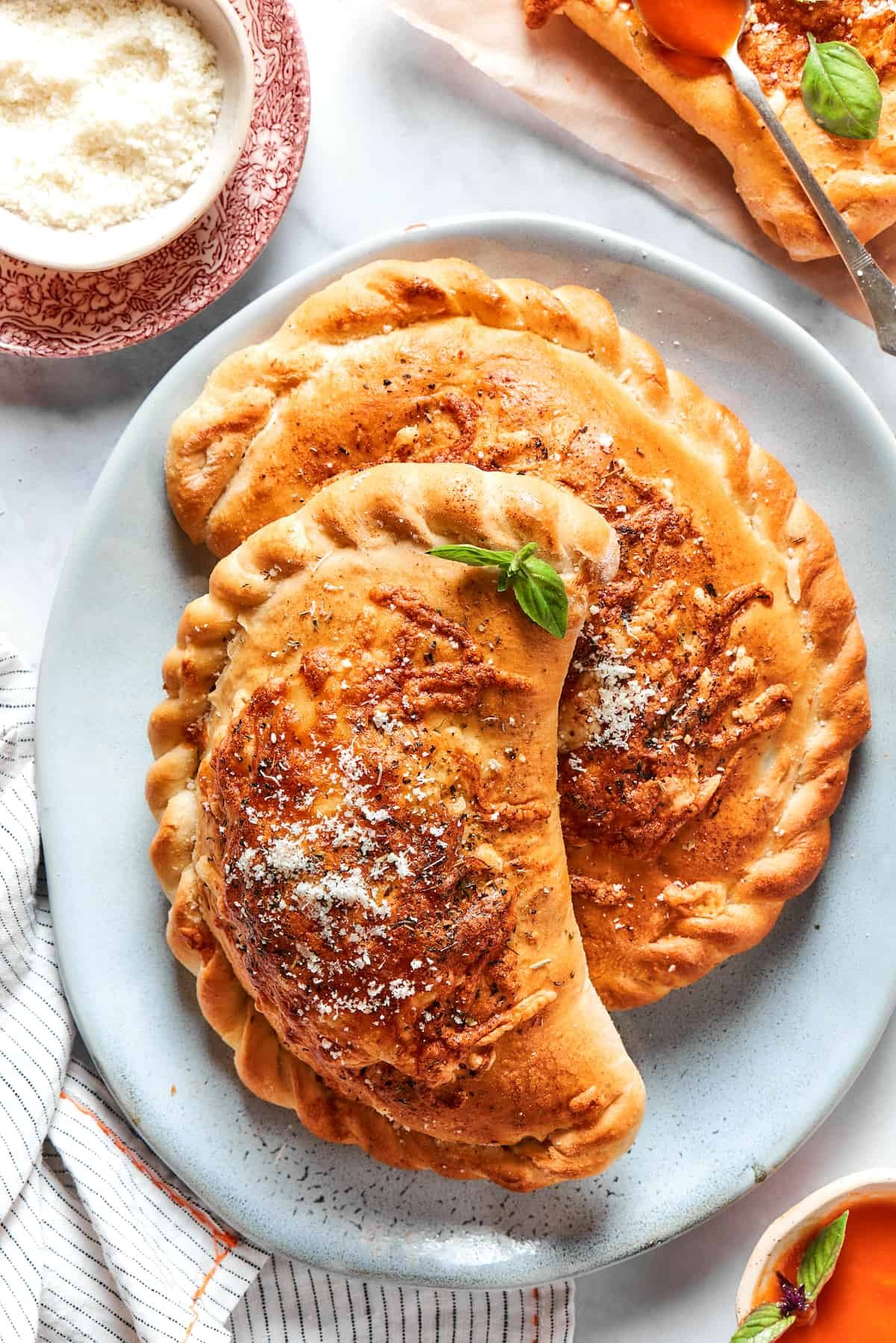 Two pizza pockets on a blue plate.