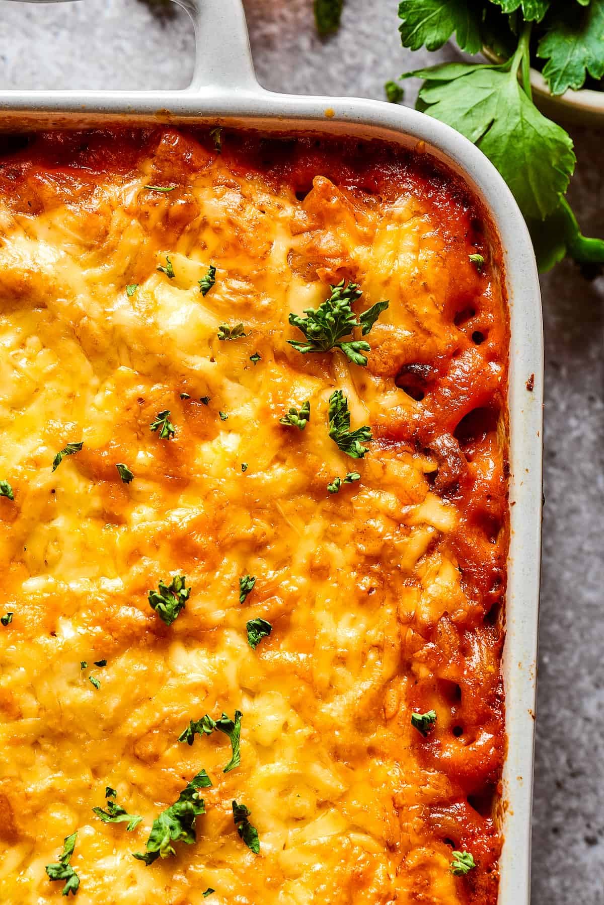 Close-up shot of the corner of a cheeseburger casserole.