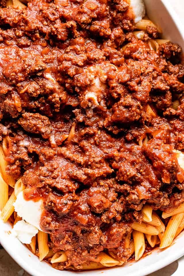 ground beef tomato sauce poured over penne pasta