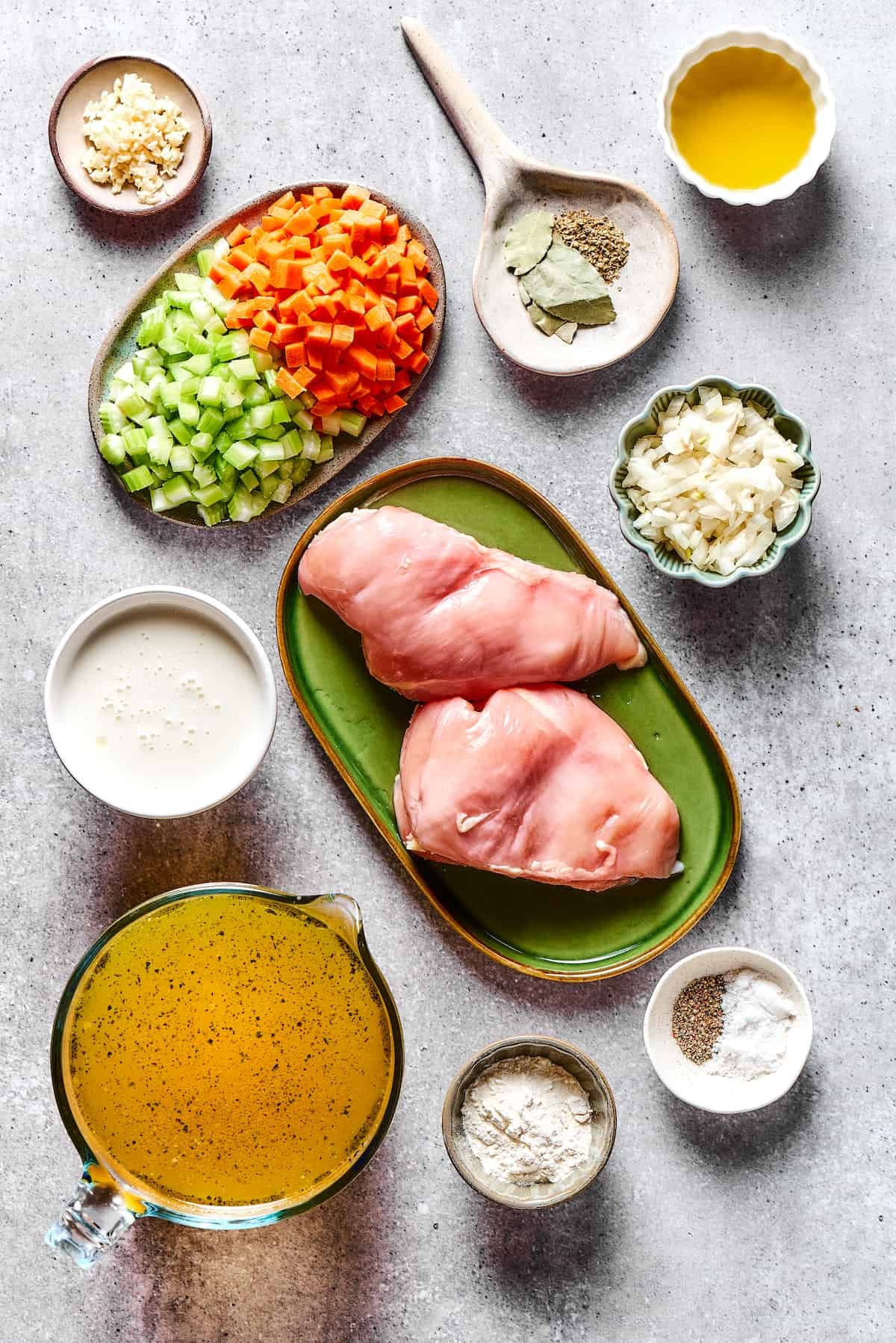Chicken and dumplings ingredients measured and arranged on a countertop.