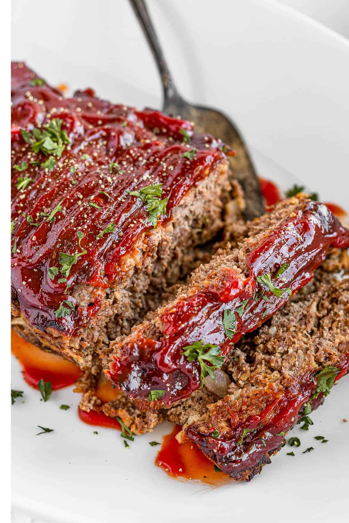 Meatloaf Covered in Barbecue Sauce on a White Serving Platter