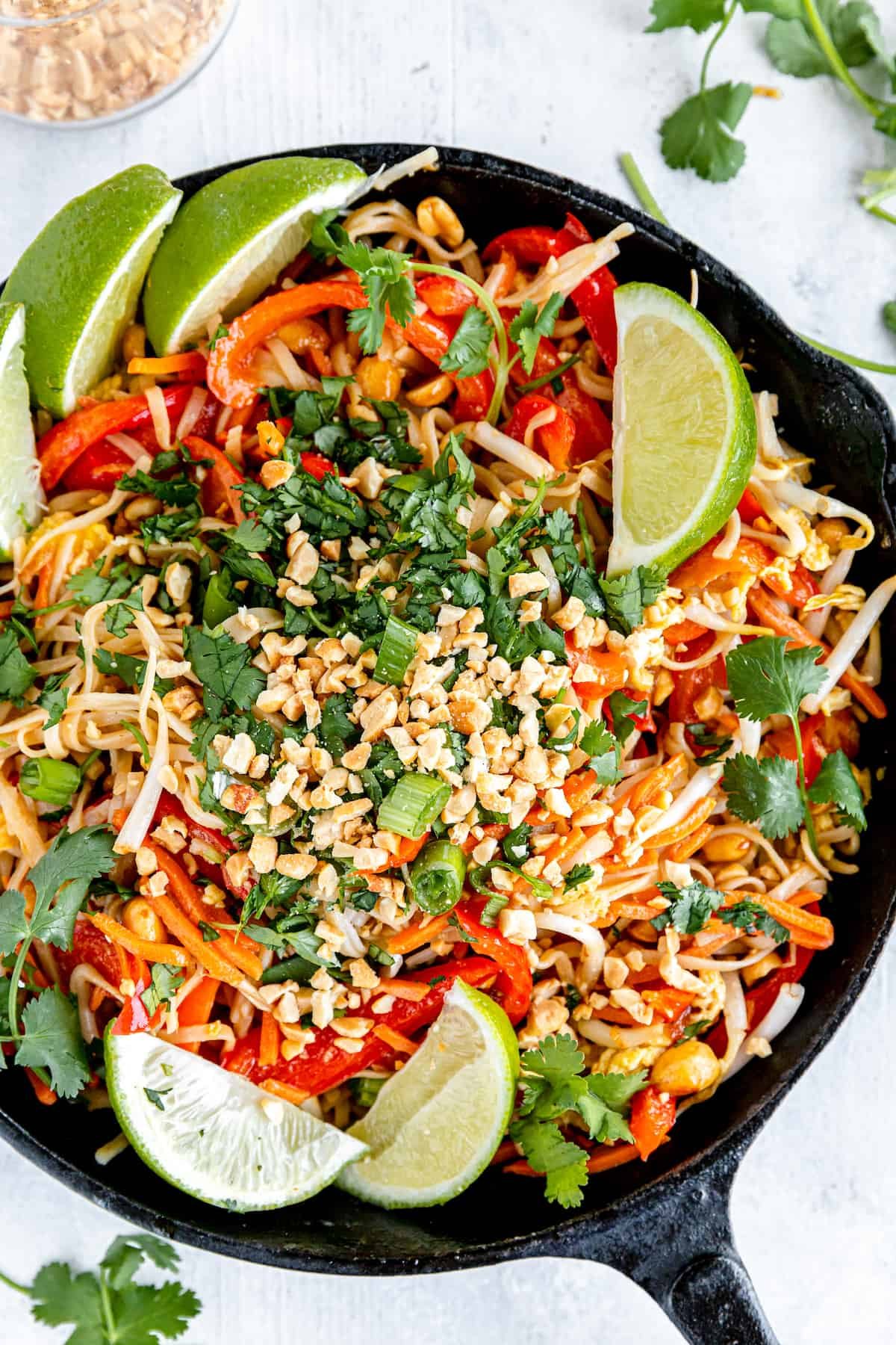 Homemade Pad Thai in a black skillet.