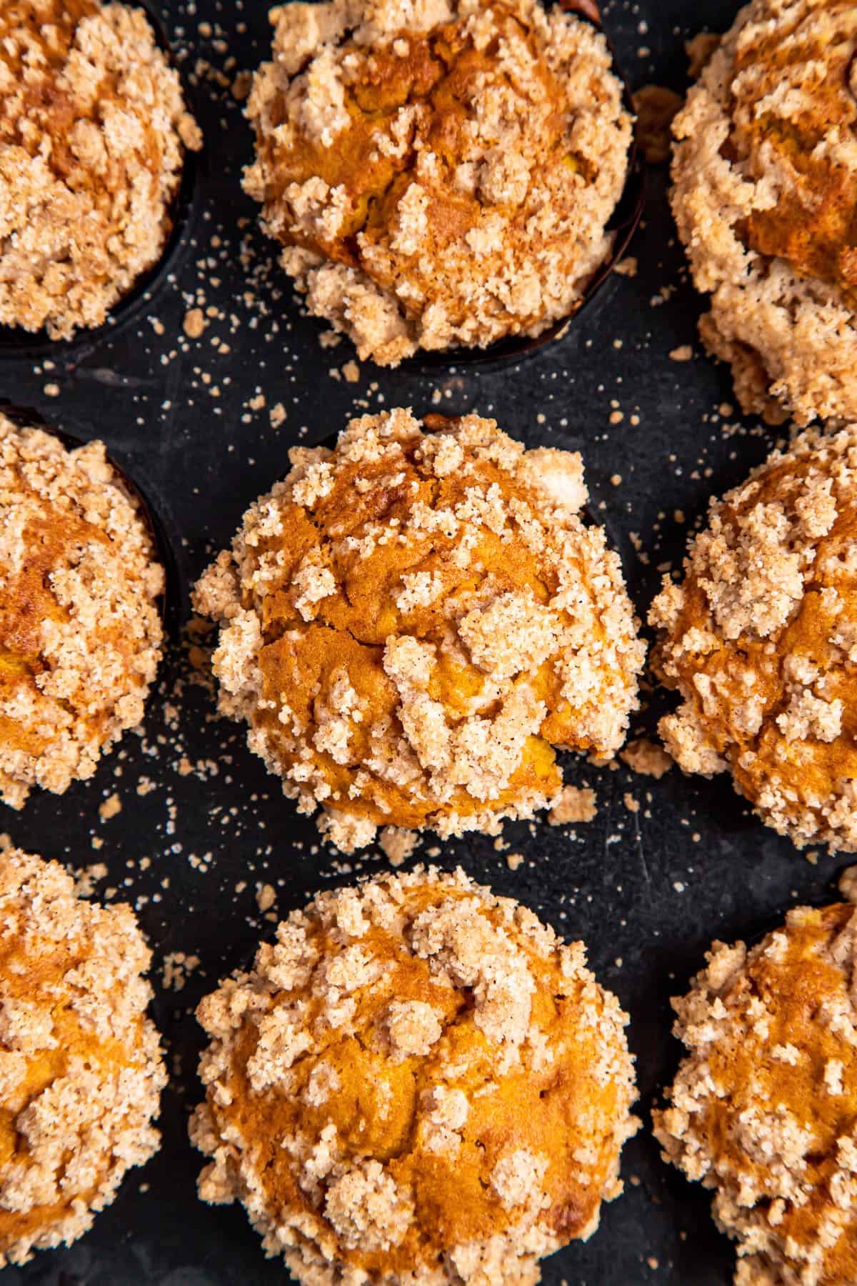 overhead shot of A baked pan of 12 pumpkin muffins