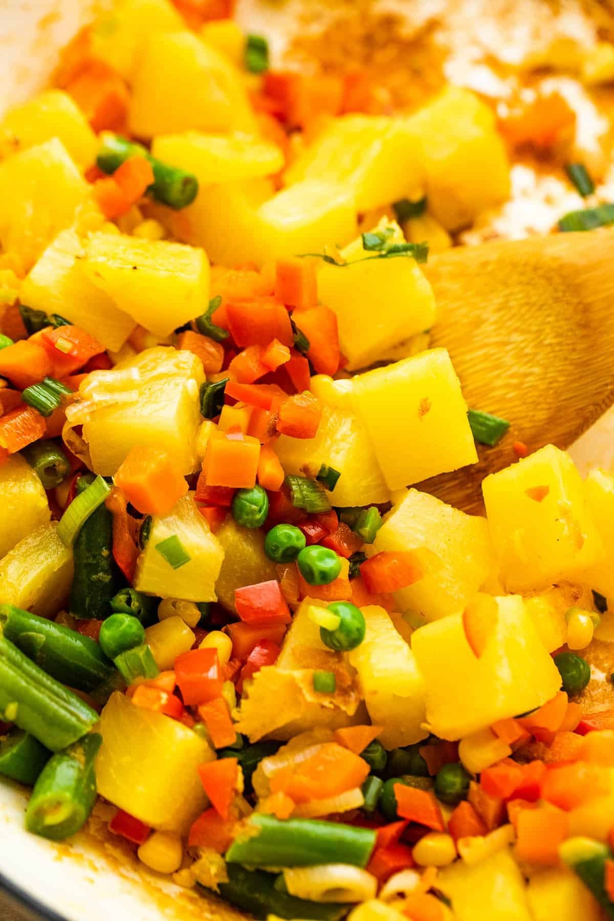 cooking pineapple chunks with veggies