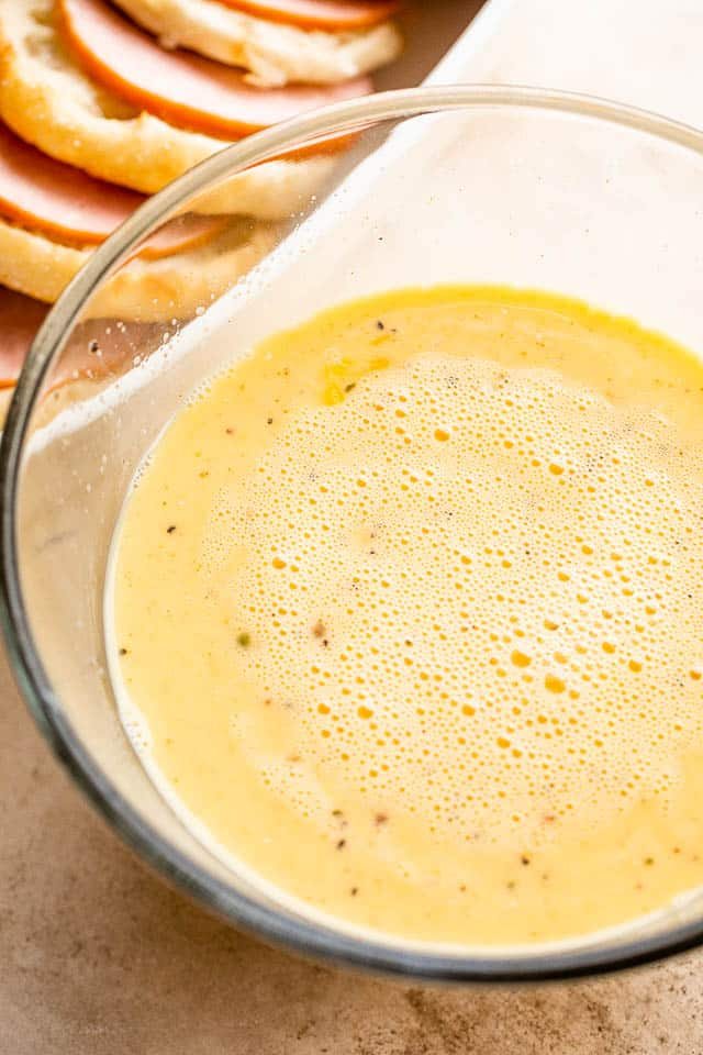 eggs and milk mixture in a large glass bowl