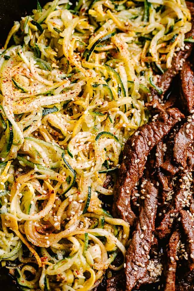 Close up of flank steak and zucchini noodles.