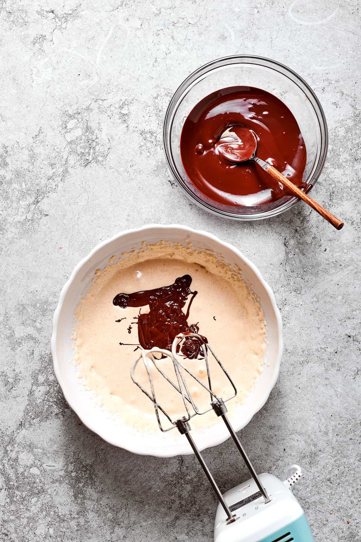 Chocolate is beaten into heavy cream.