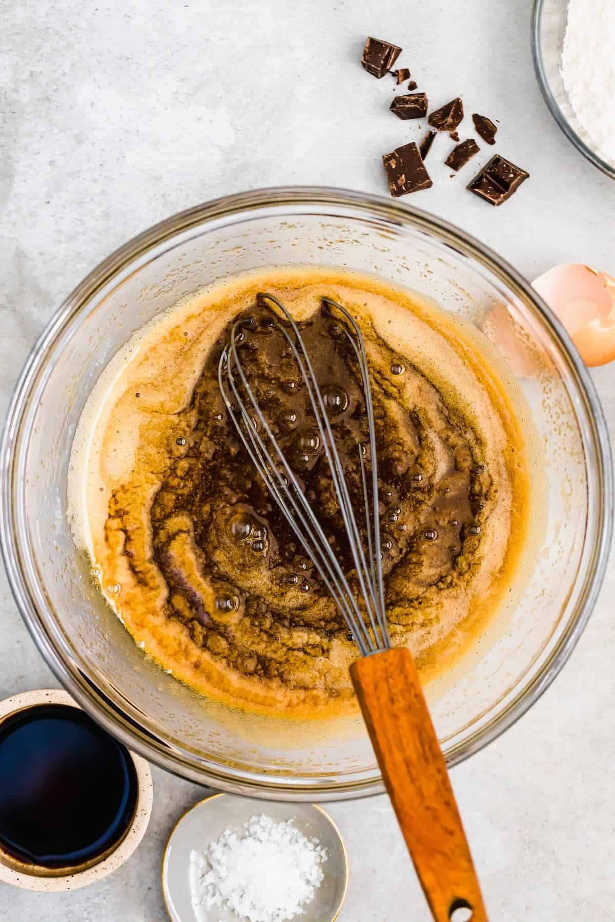 Vanilla Extract Being Mixed Into a Bowl with the Other Wet Ingredients
