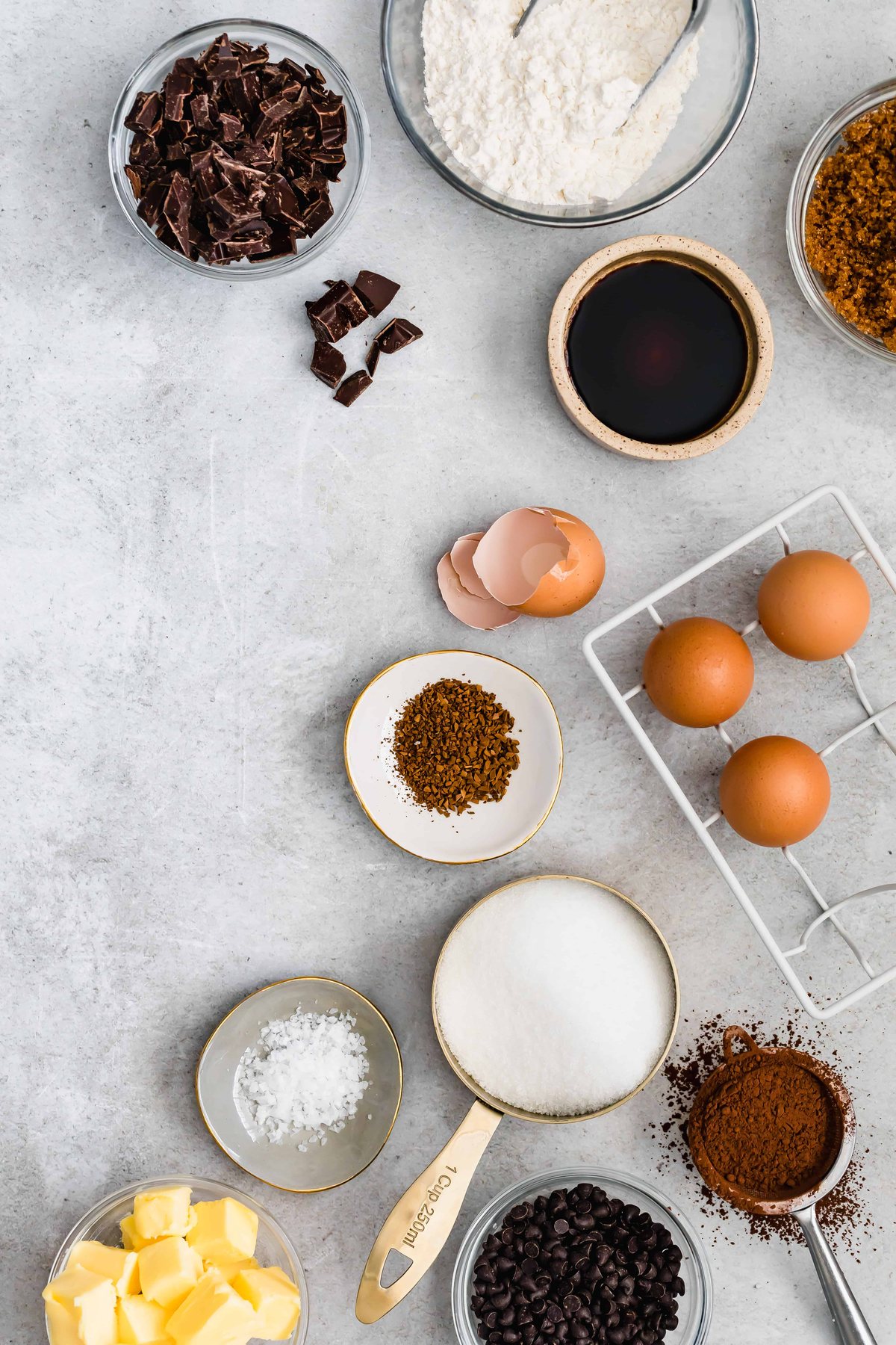 Sugar, Eggs, Chopped Dark Chocolate, and the Rest of the Brownie Ingredients on a Countertop