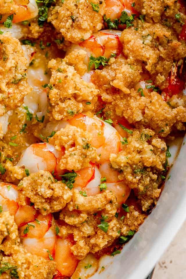 cooked shrimp topped with dollops of garlic herb butter.