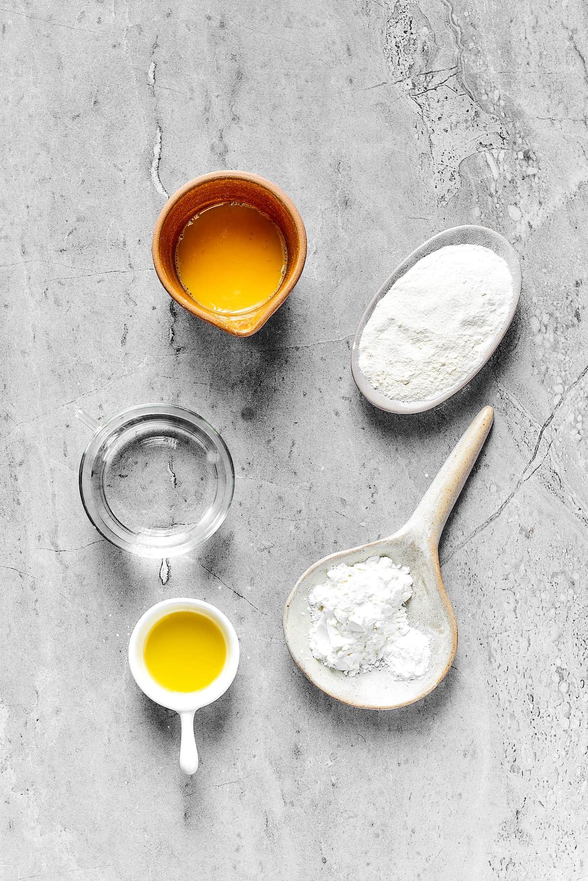 From top: Beaten egg, flour, cornstarch, olive oil, water.