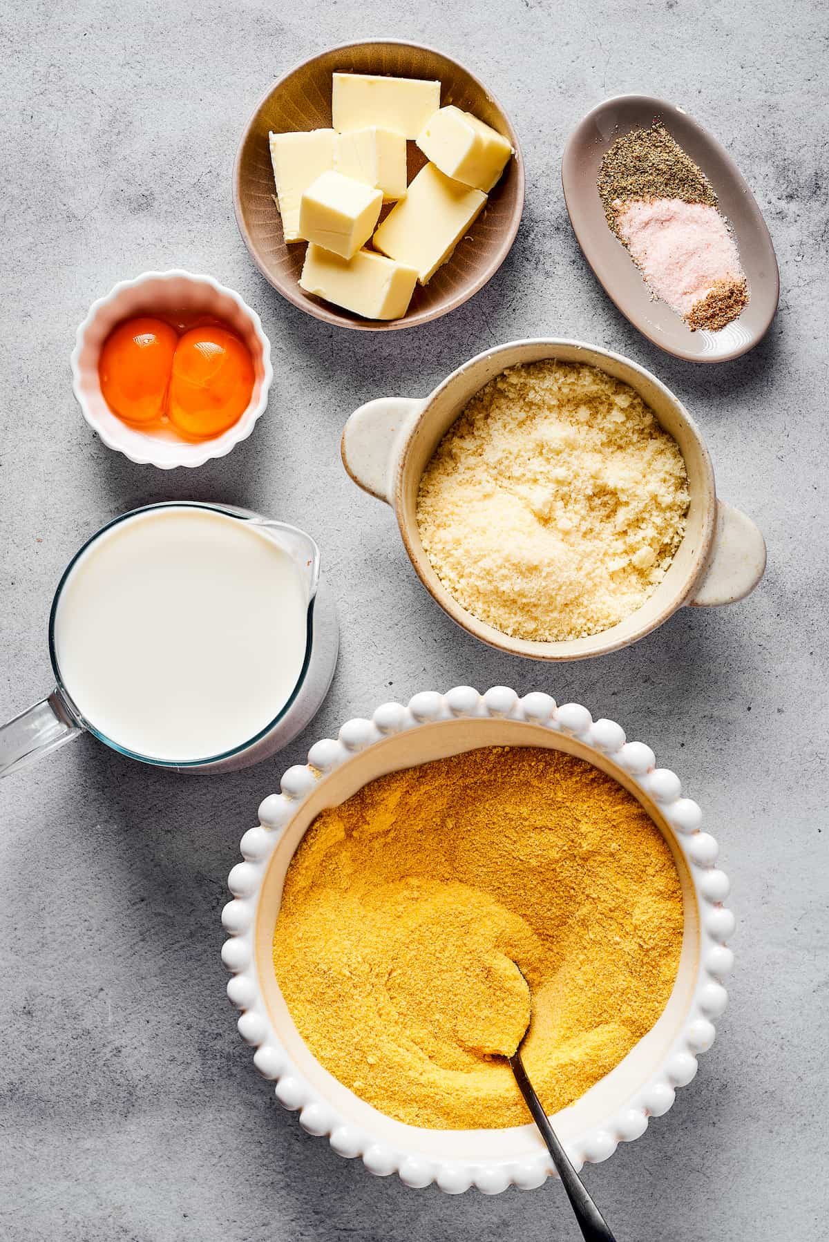 From top: Butter, seasonings, egg yolks, parmesan cheese, milk, semolina.