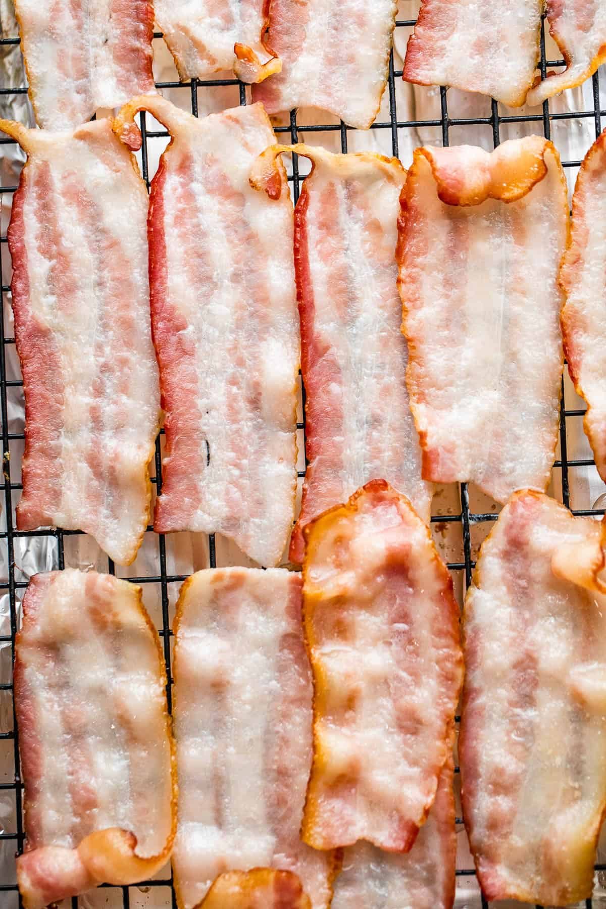 bacon slices arranged on top of baking rack
