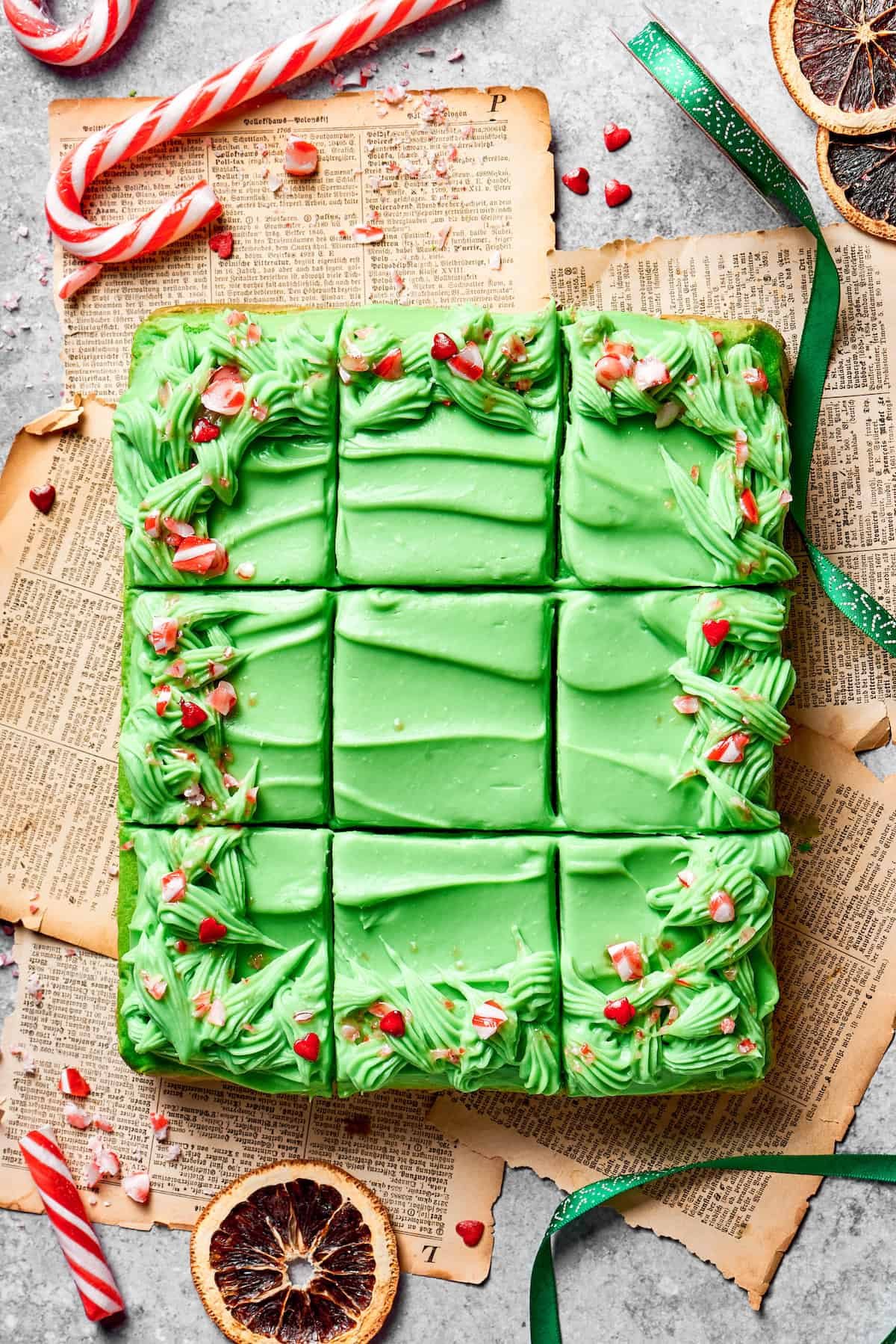 A grinch cake is cut into 12 pieces.