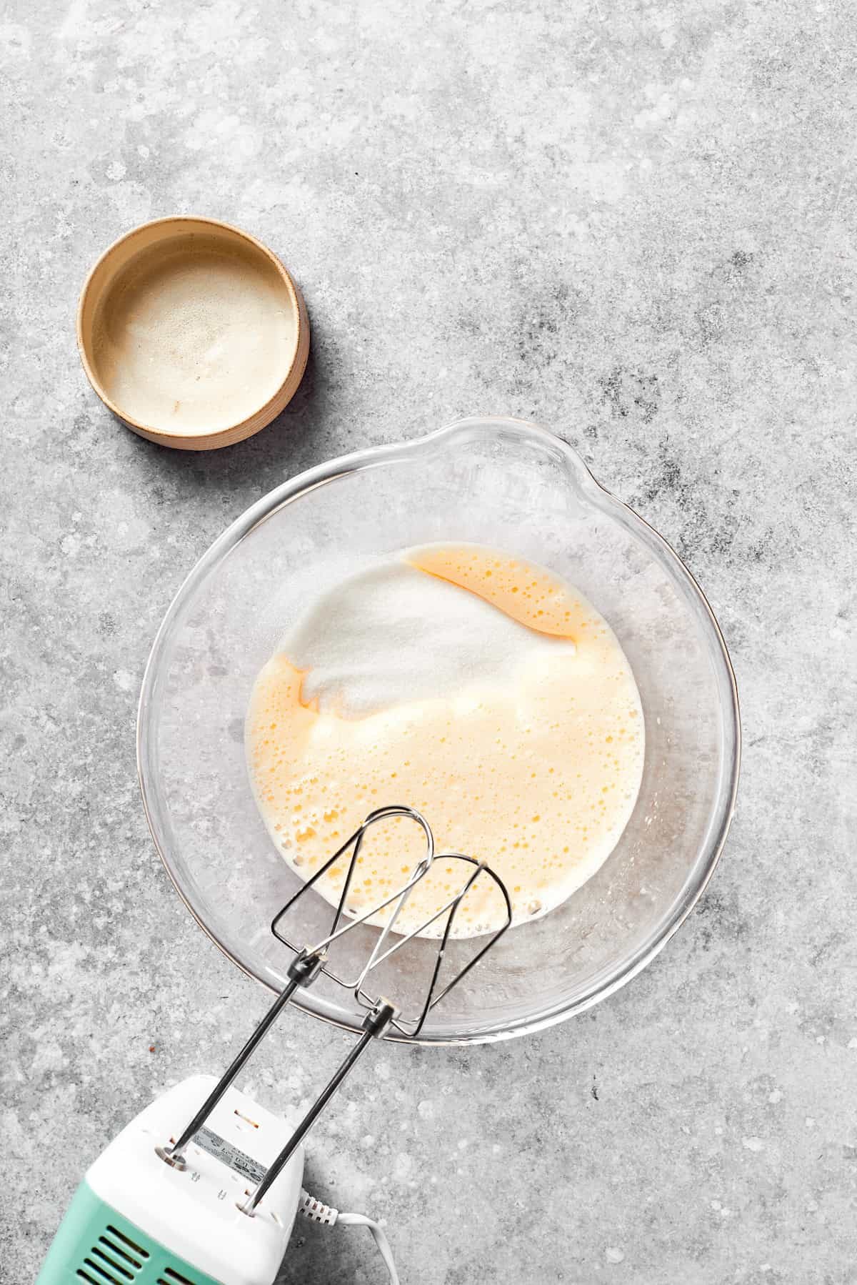 Sugar beaten into eggs.