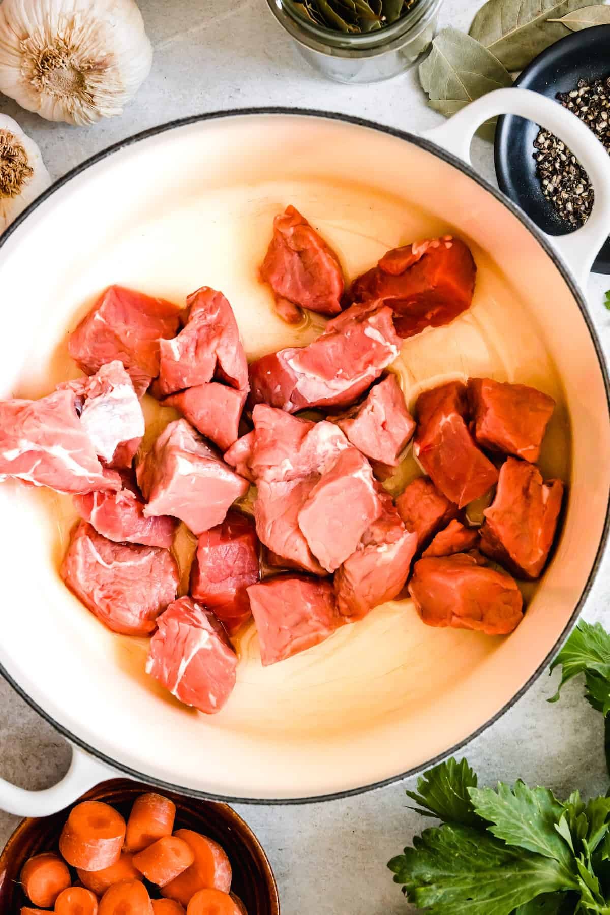 Beef chunks in a skillet.