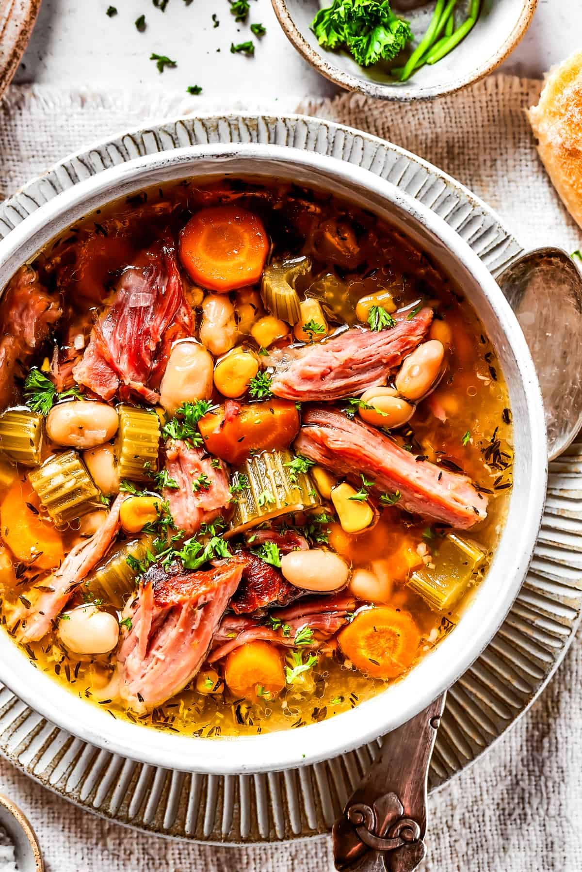 Overhead image of ham bone soup served in a bowl.