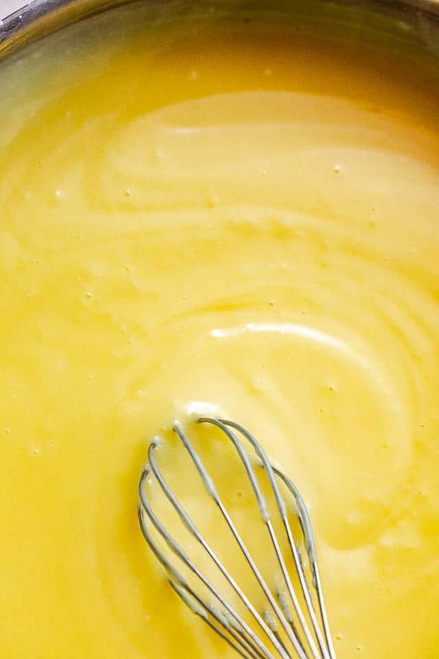 whisking homemade vanilla pudding