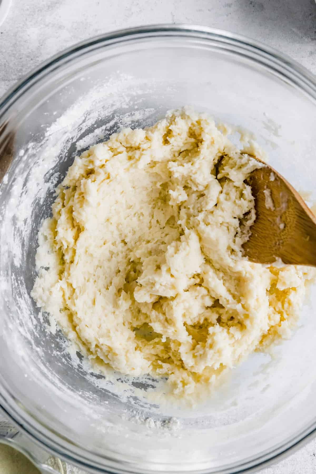 Churro Dough in a Large Glass Mixing Bowl