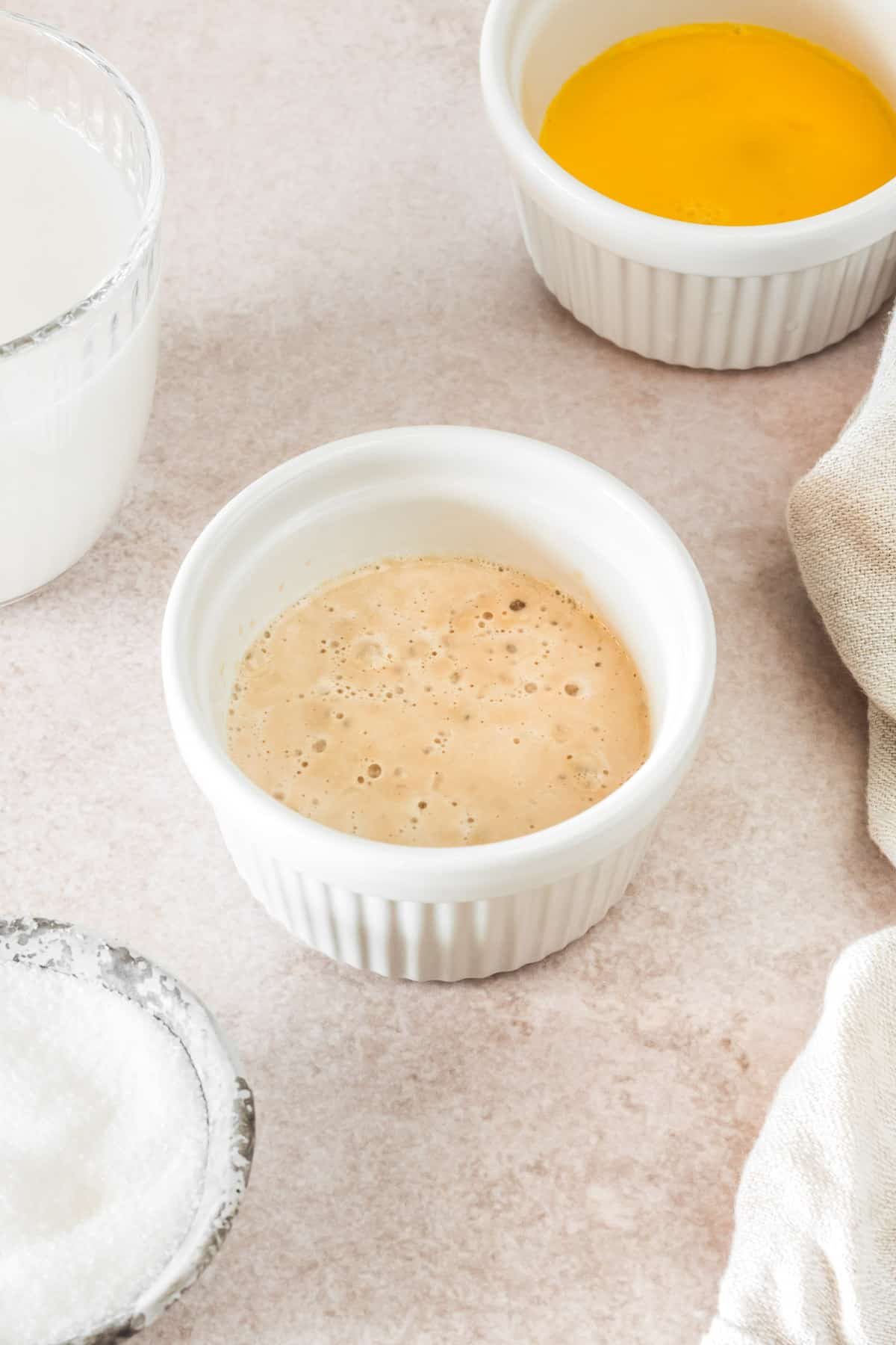Yeast and water, bubbling in a ramekin.