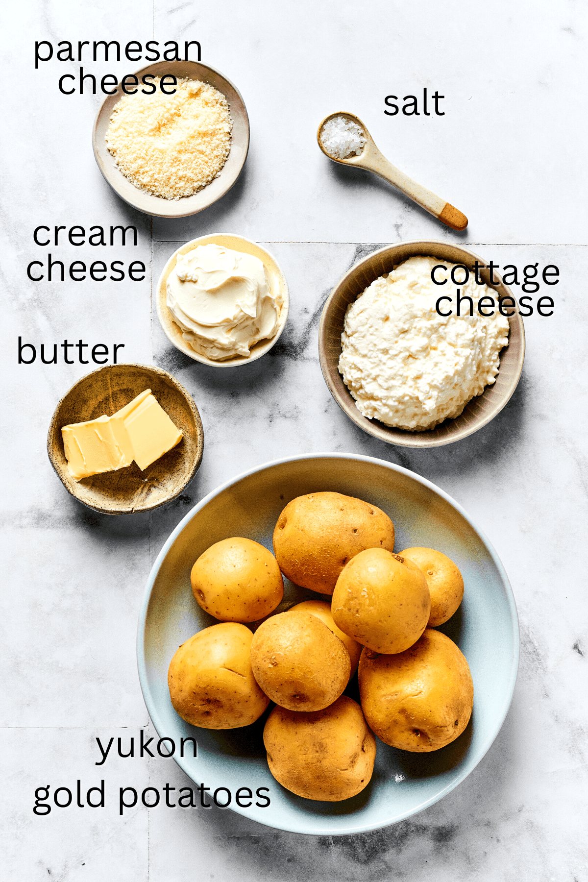 From top: Parmesan cheese, salt, sour cream, cottage cheese, butter, and Yukon Gold potatoes.
