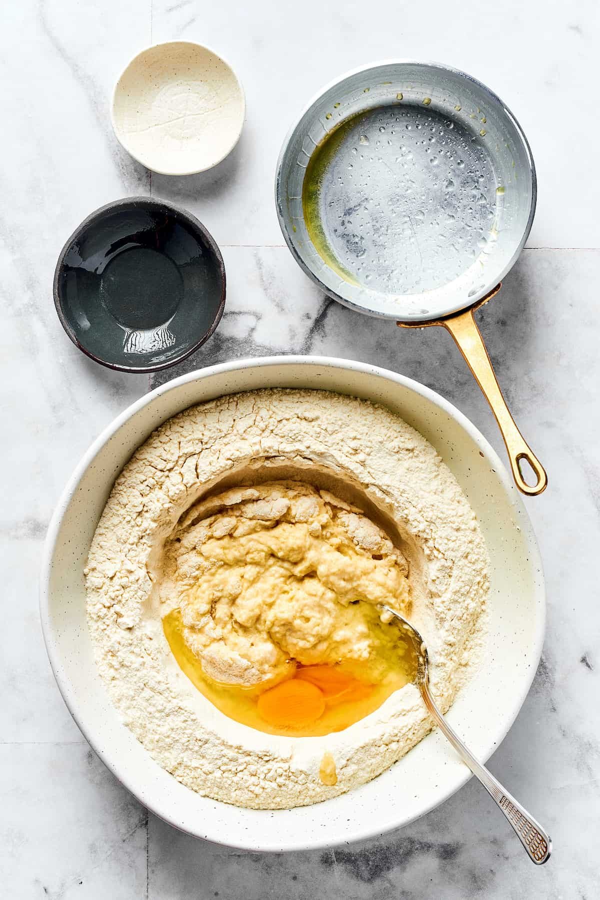 Pierogi dough ingredients in a bowl.