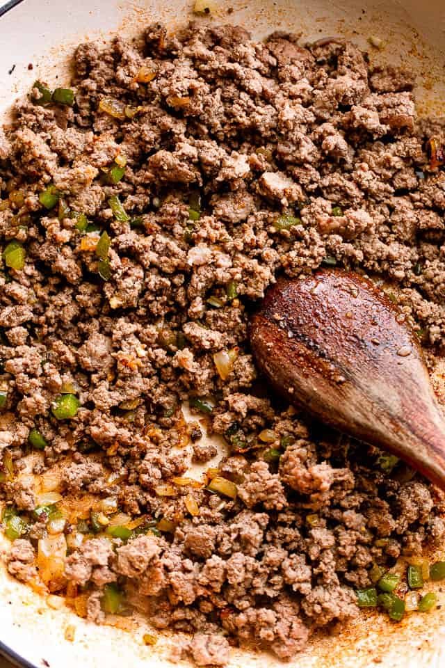 Browning ground beef in a skillet.