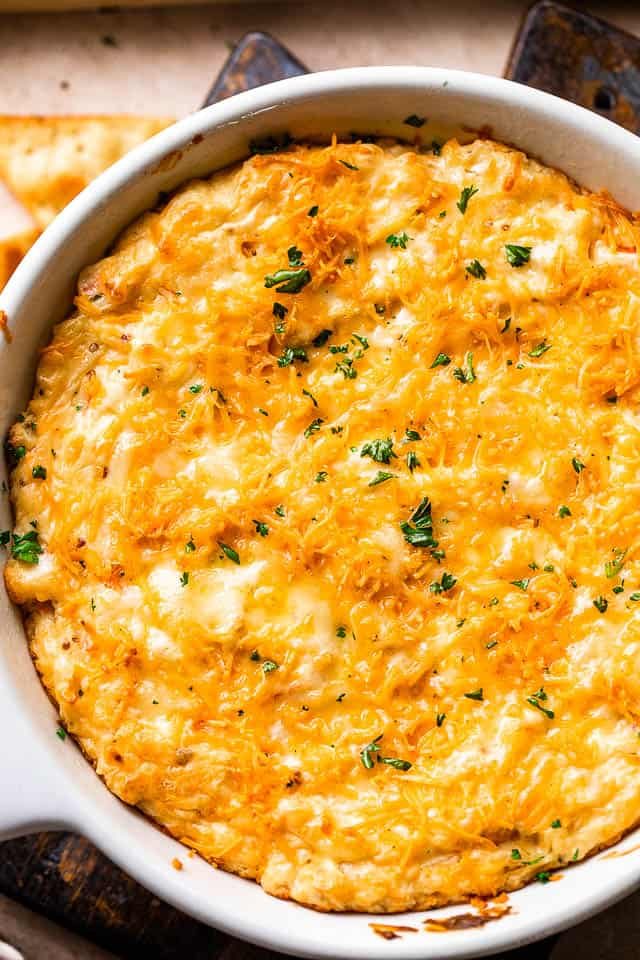 overhead shot of a white skillet with cooked crab dip