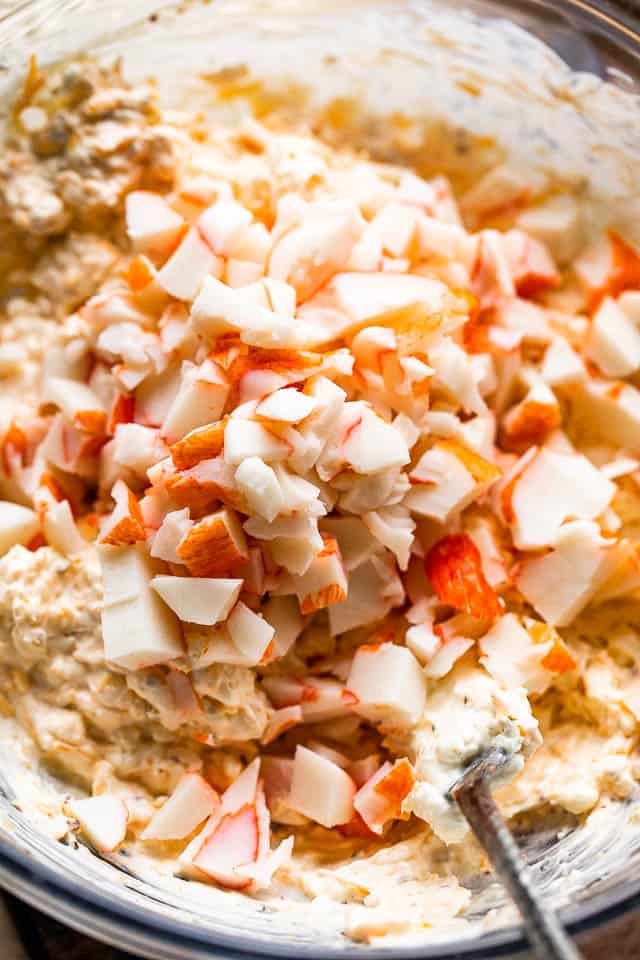 mixing crab meat into cream cheese