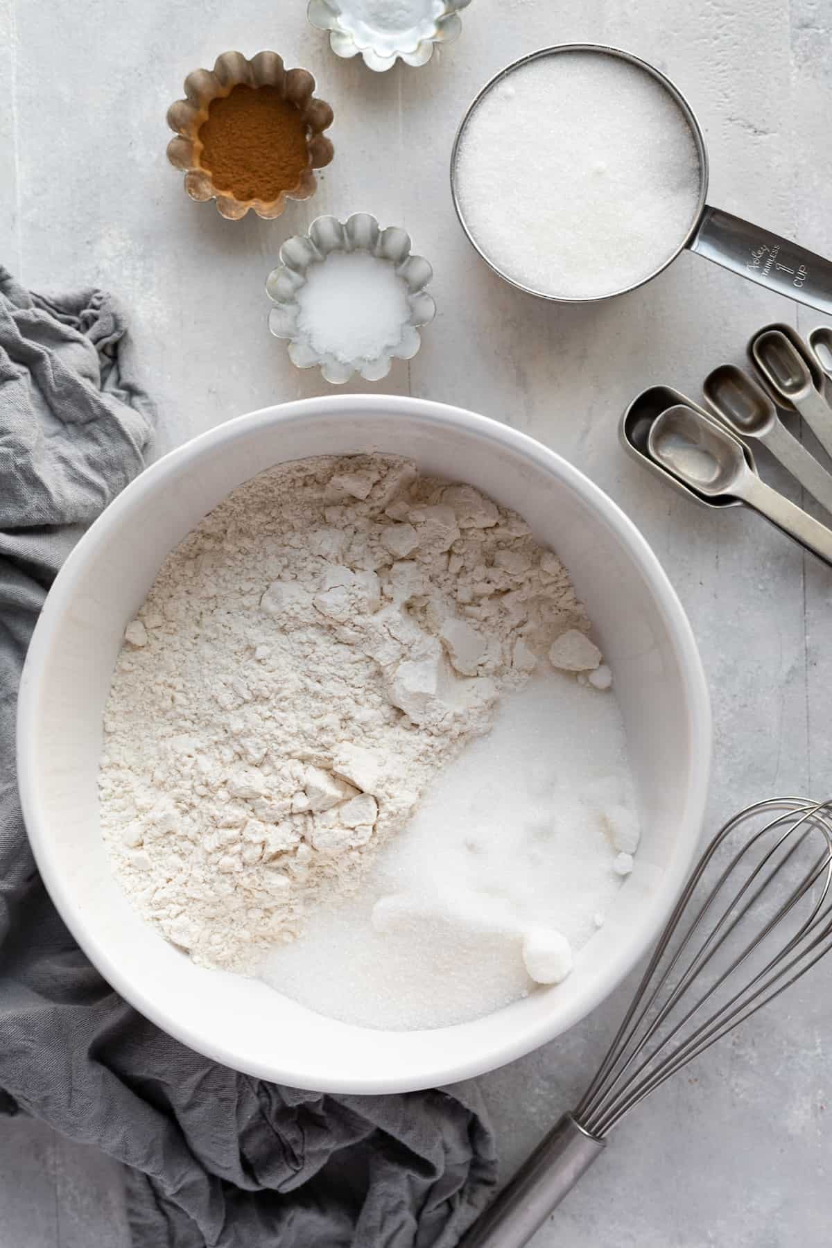 Sugar, Flour, Cinnamon and the Rest of the Dry Ingredients for The Cake on a Countertop
