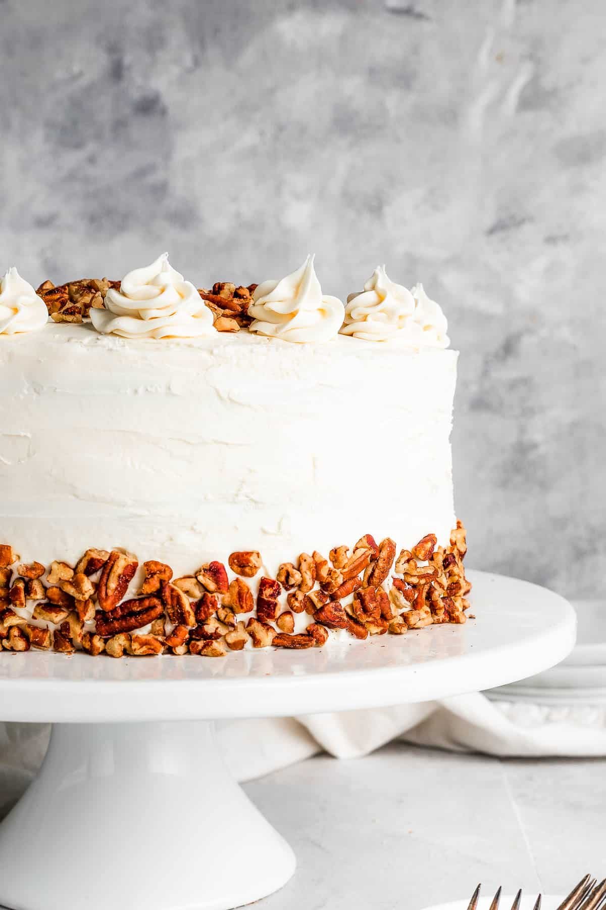 hummingbird cake on a white cake stand
